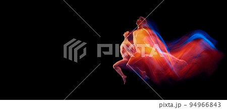 Beautiful couple of graceful and fragile ballet dancers in action isolated over black background in mixed neon light. Futurism, fantasy, miracle. Beautiful couple of graceful and fragile ballet dancers in action isolated over black background in mixed neon light. Futurism, fantasy, miracle. 94966843