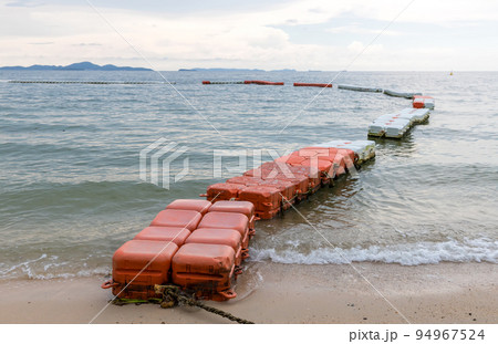 Polystyrene buoy on the sea surface. floating buoys and rope dividing area on the beach. Polystyrene buoy on the sea surface. floating buoys and rope dividing area on the beach. 94967524