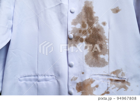 dirty sauce stain on white shirt from eating in home of daily life activity. dirty stains for cleaning concept. 94967808