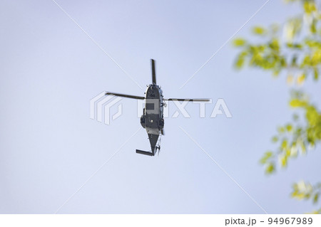 Helicopter. Spanish Air Force rehearsing for the National Day of October 12 through the streets of the city of Madrid. MADRID, SPAIN - OCTOBER 5, 2022. Helicopter. Spanish Air Force rehearsing for the National Day of October 12 through the streets of the city of Madrid. MADRID, SPAIN - OCTOBER 5, 2022. 94967989