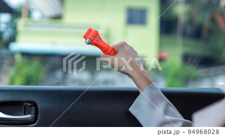 Woman use Safety Hammer and Seatbelt Cutter in Cars, Woman use Safety Hammer and Seatbelt Cutter in Cars, 94968028