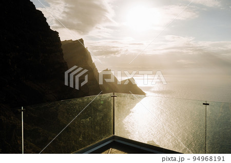 Viewpoint over a volcanic cliff and the ocean Viewpoint over a volcanic cliff and the ocean 94968191