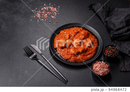 Delicious meatballs made from ground beef in a spicy tomato sauce Delicious meatballs made from ground beef in a spicy tomato sauce 94968472