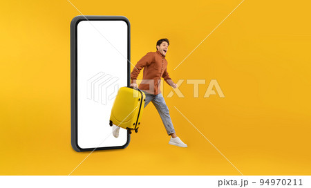 Tourist Man Jumping Out Of Huge Smartphone On Yellow Background 94970211