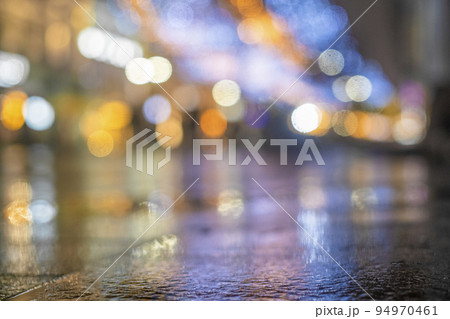 Night urban landscape, colored lights reflected in the wet asphalt in fall. Rainy night street in the city. The lights of a rainy night in the autumn city of disfocus and bokeh.  94970461