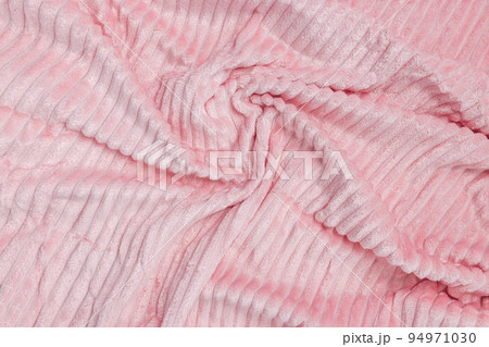 New soft pink fabric. Abstract texture background with waves and lines. Top view, closeup 94971030