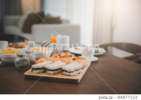 Breakfast served food with beverage coffee, orange juice on table in the morning at home Breakfast served food with beverage coffee, orange juice on table in the morning at home 94977133