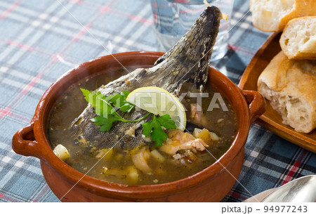 Fish soup with sturgeon in pottery 94977243