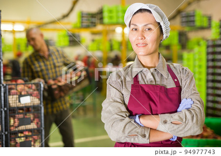 Portrait of Asian woman in warehouse 94977743