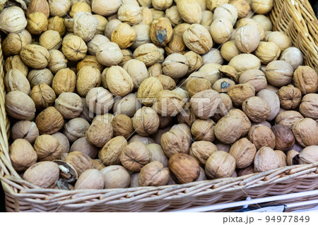 Whole walnuts in box at farmers market Whole walnuts in box at farmers market 94977849