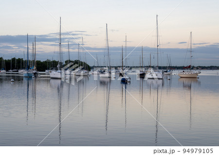 Sailboats in Dinner Key anchorage reflected in calm water of Biscayne Bay. Sailboats in Dinner Key anchorage reflected in calm water of Biscayne Bay. 94979105