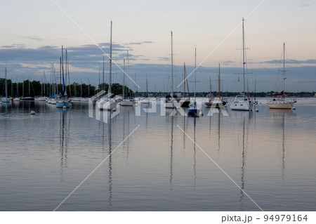 Sailboats in Dinner Key anchorage reflected in calm water of Biscayne Bay. Sailboats in Dinner Key anchorage reflected in calm water of Biscayne Bay. 94979164
