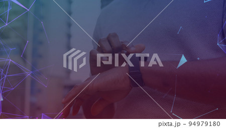 Image of networks of connections over man using smartwatch in background 94979180