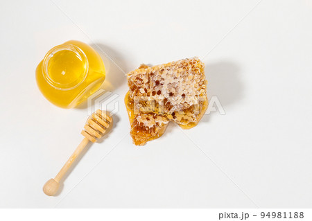 honeycomb, bottled honey, honey dipper stick 94981188