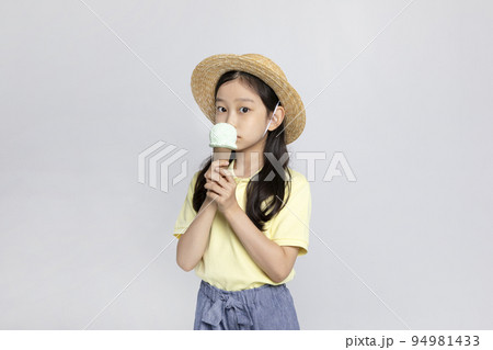 Korean young girl wearing gym clothes in white background studio__holding an ice cream 94981433