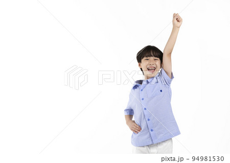 Korean young boy wearing summer blue half sleeve shirt in white background studio_smiling with one arm up 94981530