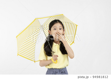 cute young Korean girl, rainy season concept in white background studio__surprised by the heavy rain cute young Korean girl, rainy season concept in white background studio__surprised by the heavy rain 94981812