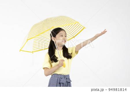 cute young Korean girl, rainy season concept in white background studio__holding an umbrella and reaching out out 94981814