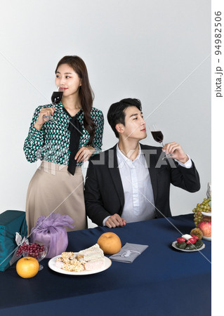 Korean young couple, man and woman wearing modern Hanbok_drinking wine couple 94982506