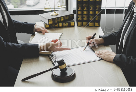 Male lawyers or a judge counseling clients about judicial justice and prosecution with scales, judges gavel, legal documents legal services concept Male lawyers or a judge counseling clients about judicial justice and prosecution with scales, judges gavel, legal documents legal services concept 94983603