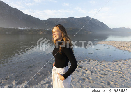 South Africa, Hermanus, Teenage girl (16-17) on Grotto Beach 94983685