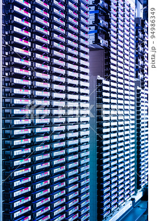 robotic data archive center with large amount of magnetic tapes 94986349