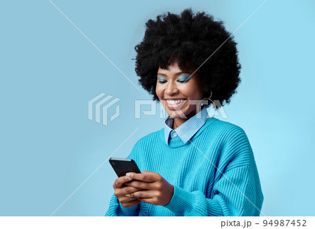 Mockup, smile and black woman with phone typing a online communication message to a contact using social media app. Retro, vintage and happy girl with afro hair doing a internet, web or online search Mockup, smile and black woman with phone typing a online communication message to a contact using social media app. Retro, vintage and happy girl with afro hair doing a internet, web or online search 94987452