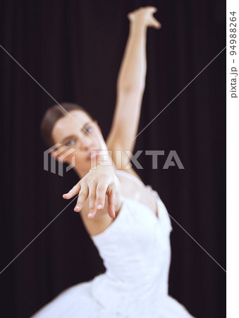 Dancer performance stage to ballet music, young theatre woman dancing and action movement posture. Concert hall, posture grace of ballerina dance on black background wall and balance body exercise 94988264