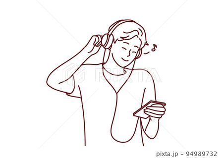 Smiling guy in earphones listen music on mobile 94989732