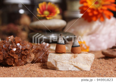 Aragonite Crystal With Incense Cones on Australian Red Sand Aragonite Crystal With Incense Cones on Australian Red Sand 94991823