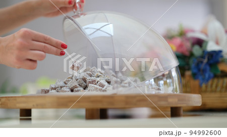 Hand selection of Turkish delight with coconut and pistachios on table. Hand selection of Turkish delight with coconut and pistachios on table. 94992600