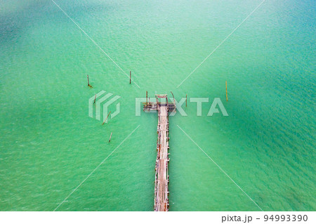 Wooden bridge at Ao Talet or Ta Lhet bay, Nakhon si Thammarat, Thailand 94993390