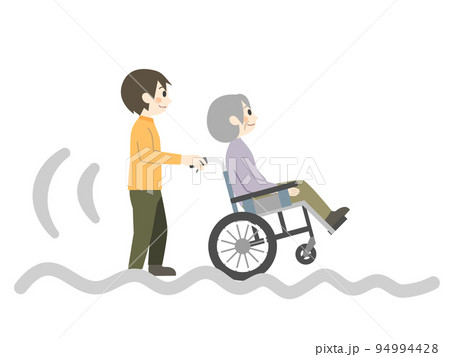 でこぼこ道を車椅子で進む介護士 94994428