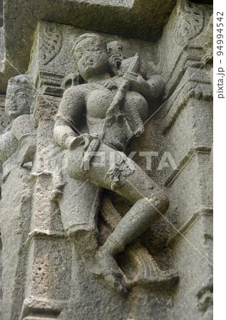 Sculptures carved on the outer wall of the Laxminarayana temple one of the five rock temples inside Bahadurgad, Pedgaon, Taluka Shrigonda, Maharashtra, India 94994542