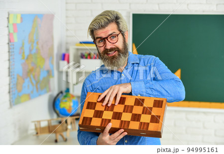 Smart people play chess. strategy concept. management and leadership. Board game. Man play chess. planning strategy with chess figures. strategy ideas. teacher at tournament. competition success play 94995161