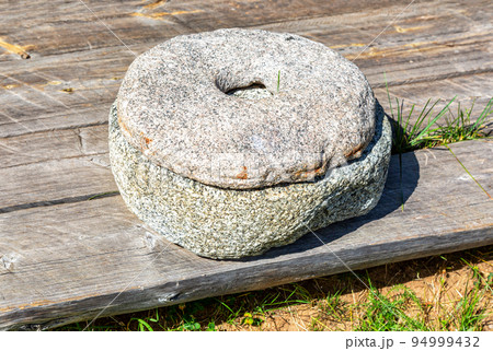 Ancient stone mill for grinding cereal grains Ancient stone mill for grinding cereal grains 94999432