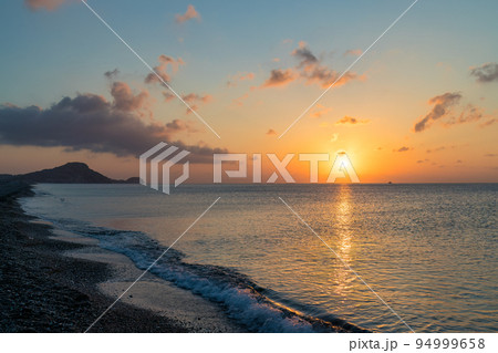 Afandou sea beach in Rhodes at sunrise of sunny summer day. 94999658
