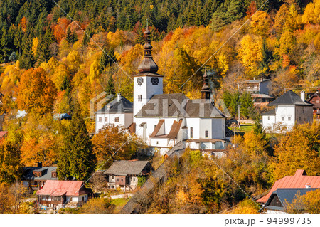 Church in The Spania Dolina village at autumn season, Slovakia. 94999735