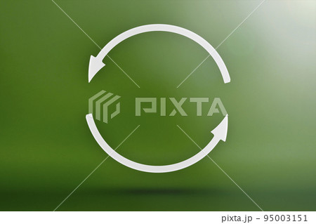 Ecology, recycling symbol, white arrows form a circle. 3D image on a green background. Green products, green renewable energy, graph pointing up and down 95003151
