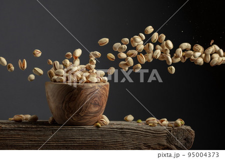 Flying salted pistachios. 95004373