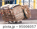 A janitor cart with packed cardboard. 95006057