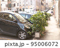 Parking in the small streets of Rome. 95006072