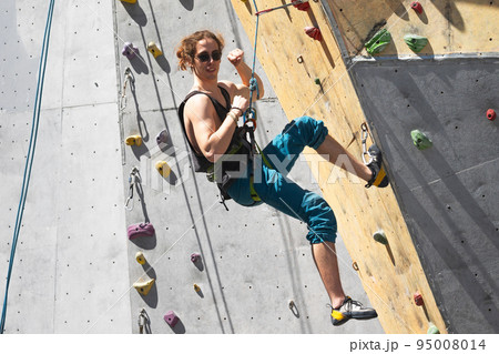 man climbing up the wall man climbing up the wall 95008014
