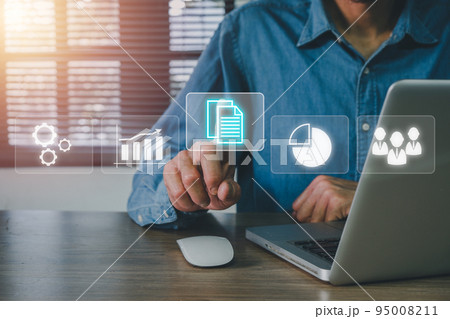 Enterprise Resource Planning ERP, document management concept with icons on virtual screen, Businessman hand poiting erp icons on virtual screen on office desk. Enterprise Resource Planning ERP, document management concept with icons on virtual screen, Businessman hand poiting erp icons on virtual screen on office desk. 95008211