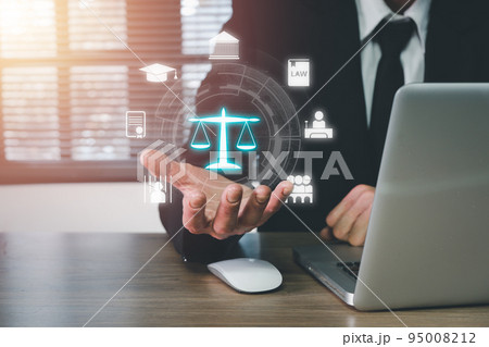 Justice and law concept, Man hand holding VR screen law icon background on office desk. Justice and law concept, Man hand holding VR screen law icon background on office desk. 95008212