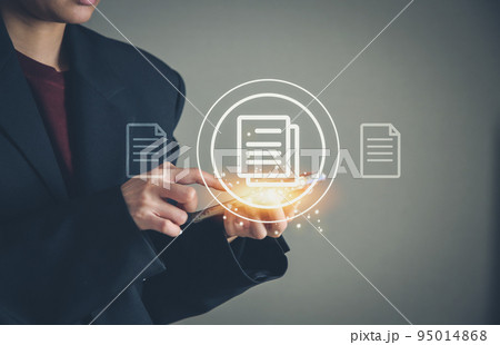 Businesswoman using mobile smart phone and pointing a file of digital paper work, Corporate business technology. 95014868