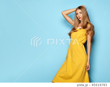 Blonde young woman in floral spring summer dress 95019765