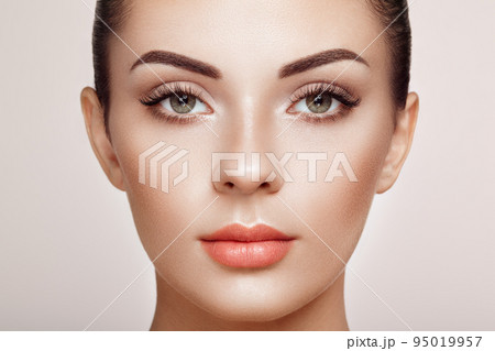 Beautiful woman with long false eyelashes 95019957