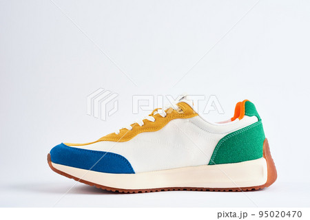 Sport sneakers against white background, Casual trendy shoes closeup, Creative minimal design with copy space Sport sneakers against white background, Casual trendy shoes closeup, Creative minimal design with copy space 95020470