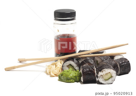 Sushi rolls cucumber japanese food with chopsticks and soy sauce isolated on white Sushi rolls cucumber japanese food with chopsticks and soy sauce isolated on white 95020913